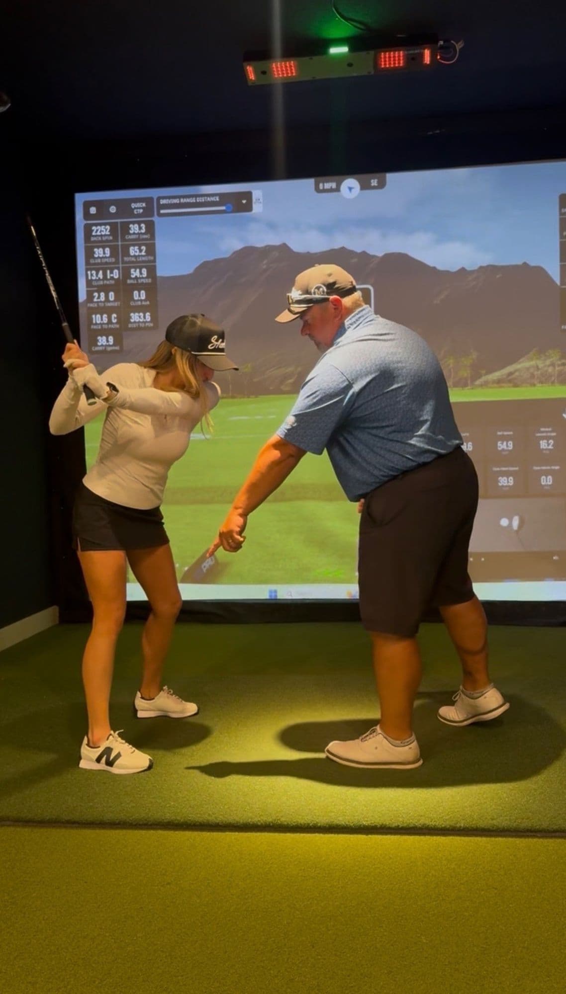 Jimmy Krupa coaching a golfer on the simulator