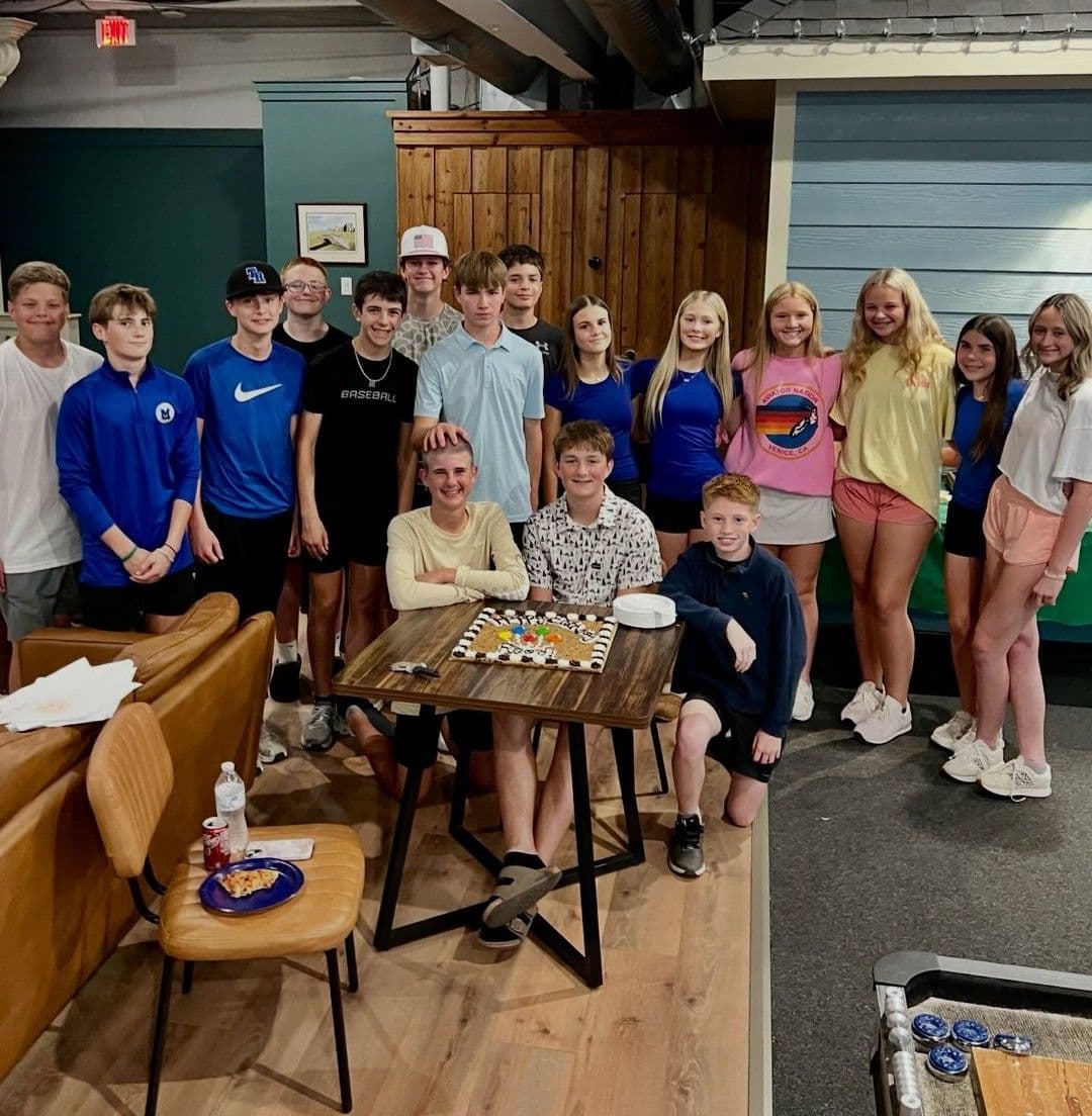 A large group of friends celebrating together at The Golf House