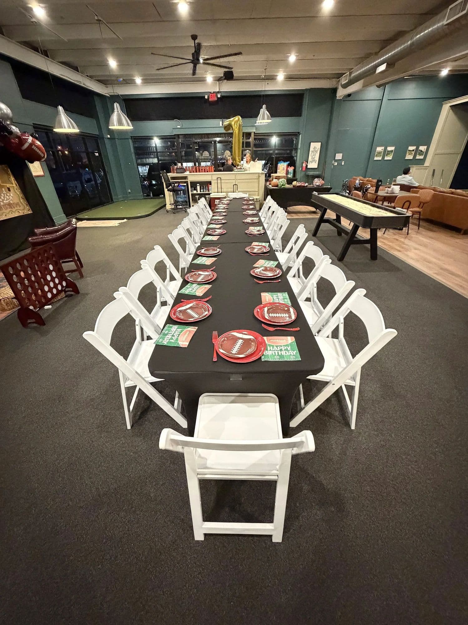 A long party table set up in the lounge