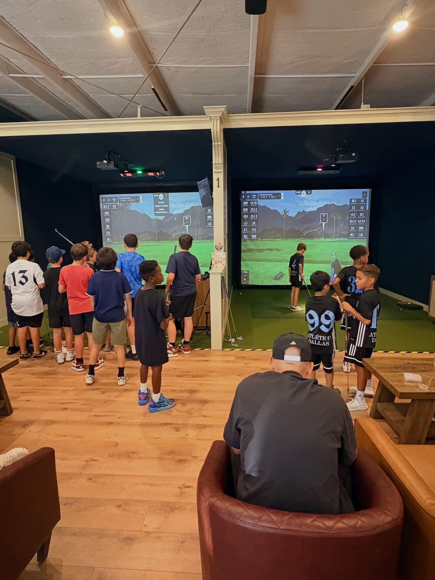 A youth team gathered in the simulator bays