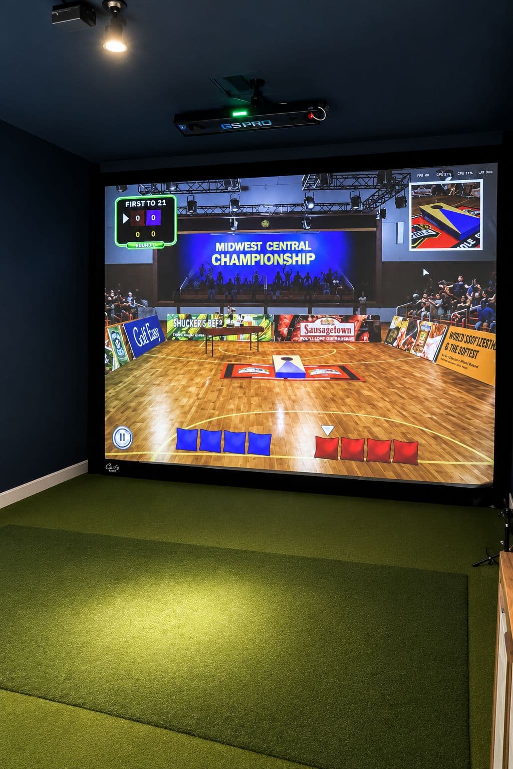 A cornhole game on the multi-sport simulator