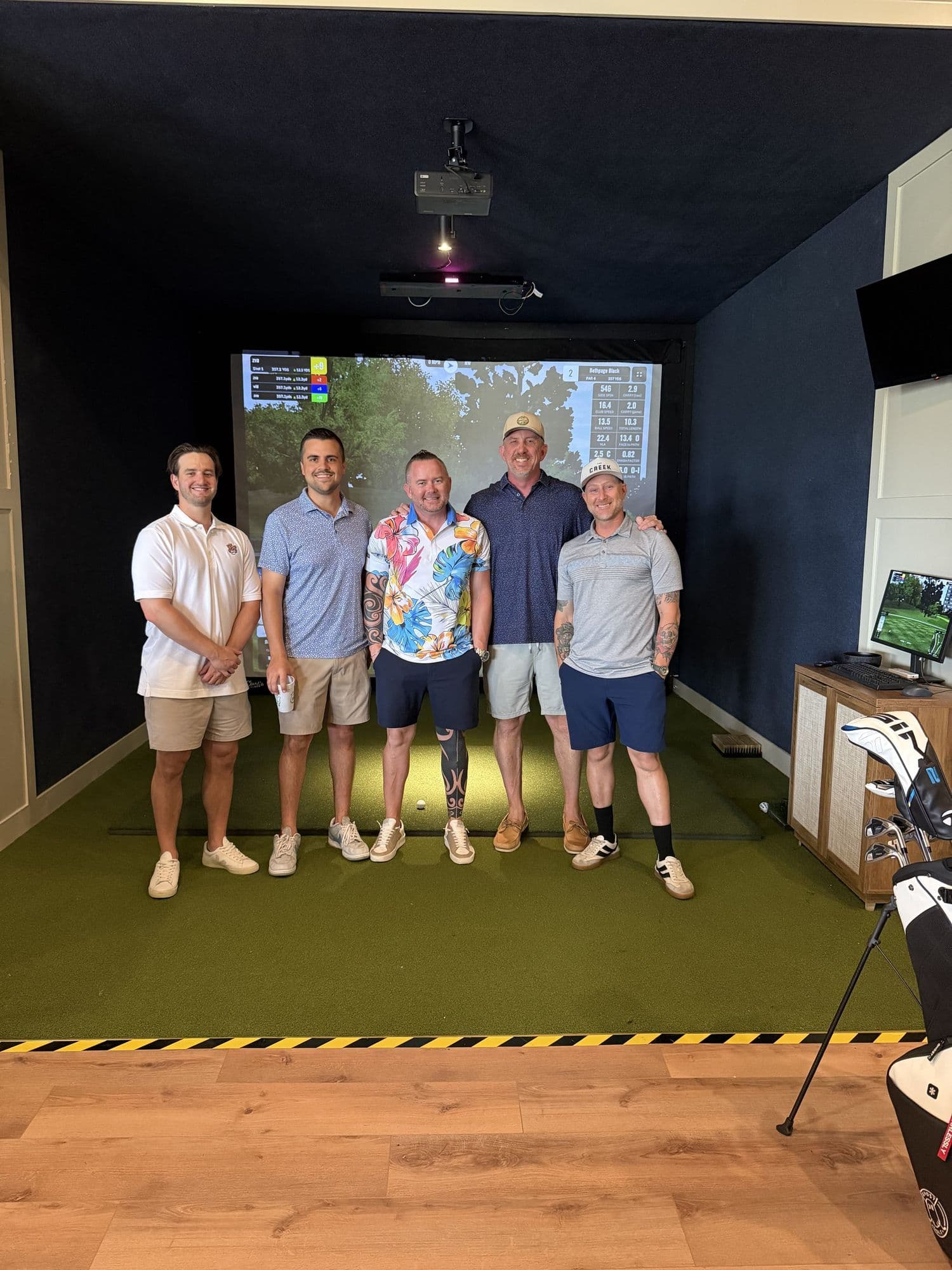 A group of friends after a round in a simulator bay